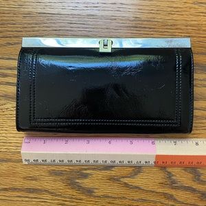 Poppie patent leather clutch